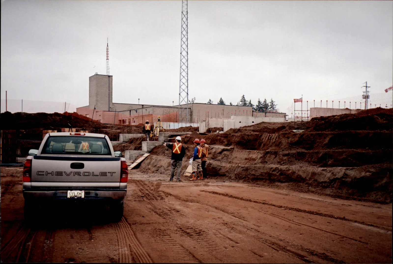 Survey crew working at an active construction site