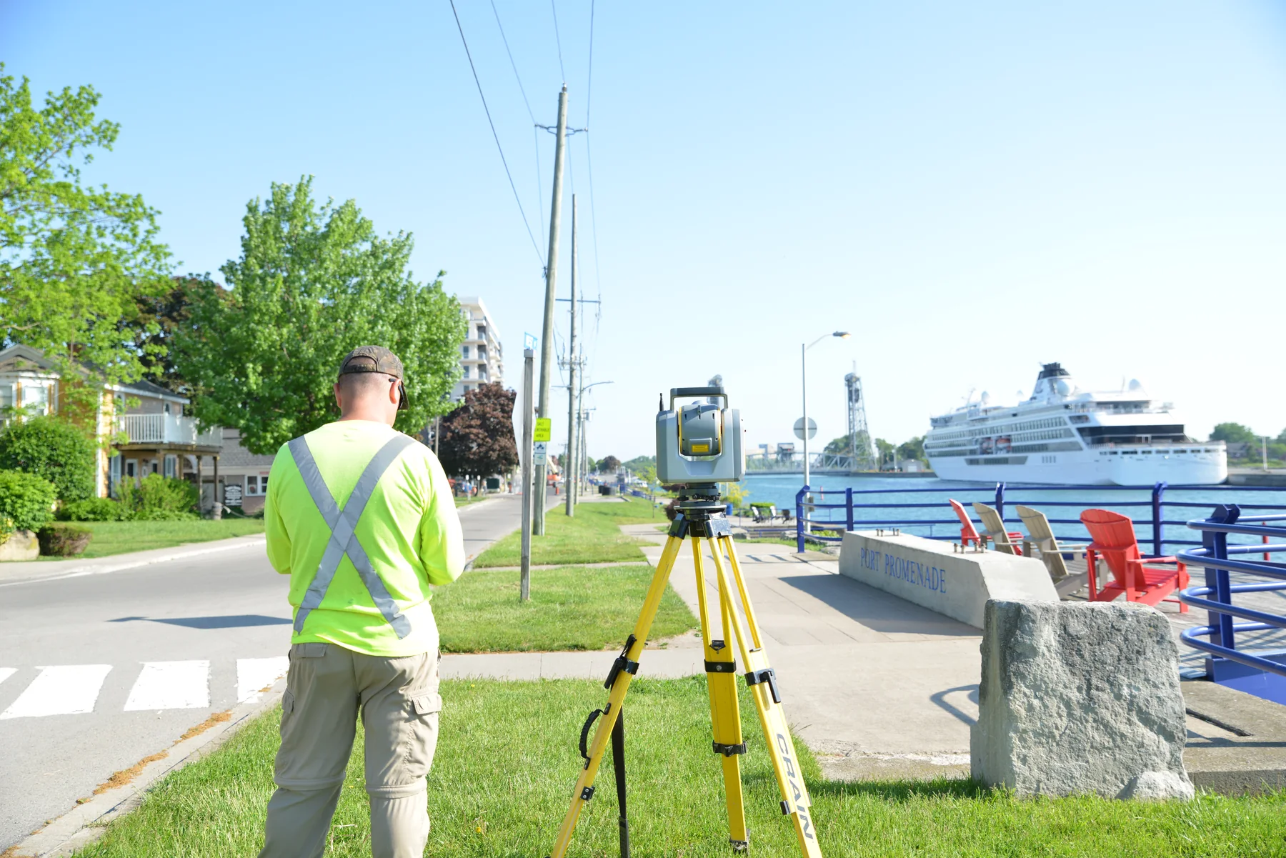 Surveyor operating field equipment beside the Welland Canal in Port Colborne